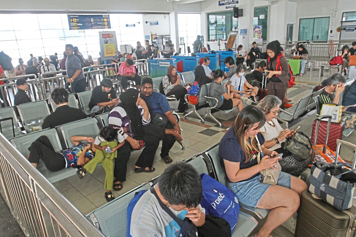 Travellers face a long wait in hot conditions at the Butterworth train station.