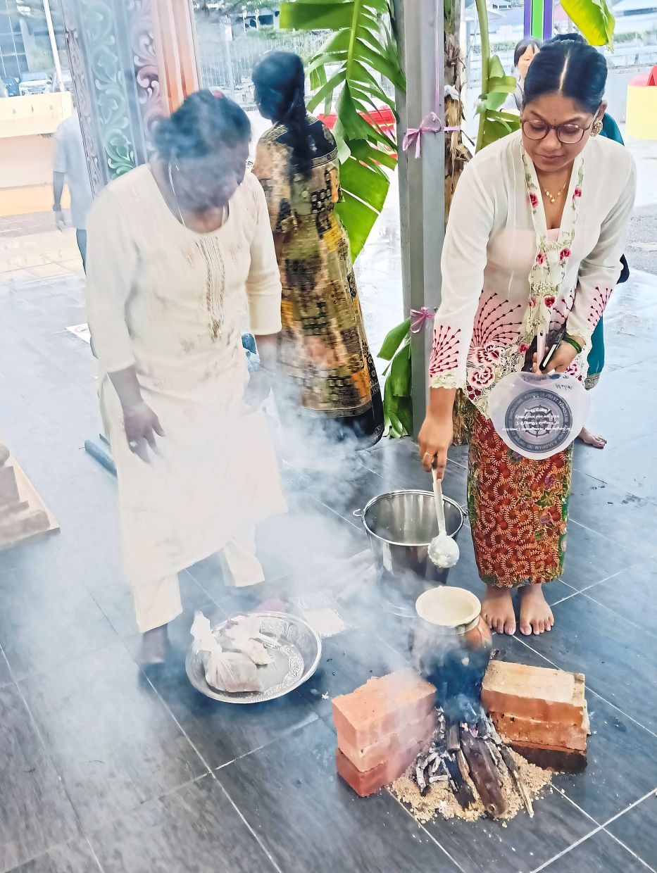 Sweet treat: On the final day, Kanni Ponggal, unmarried Chitty ladies prepare Ponggal and serve it at the temple.