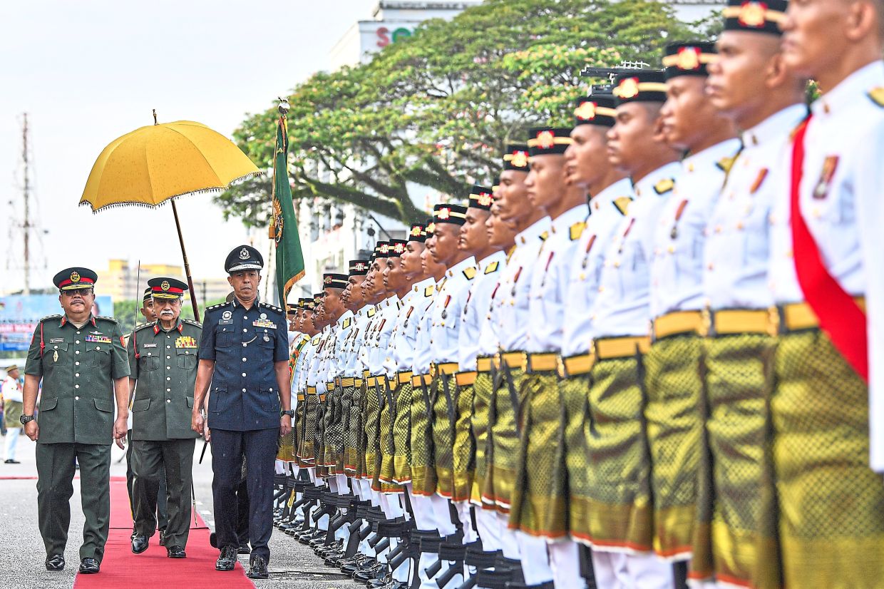 Tuanku Muhriz inspecting the Main Guard of Honour parade by the 15th Battalion of the Royal Malay Regiment, Senawang Camp, during the Negri Sembilan National Day celebration held opposite the Seremban City Council field on Aug 31, last year. — Bernama