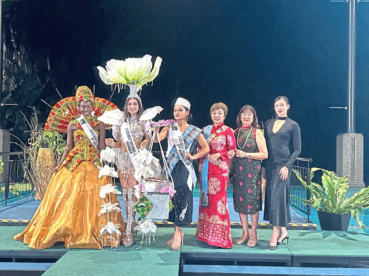 Tan (third from right) with some of the participants at the Miss Orient Tourism Global Gala Night, which featured a national costume competition celebrating culture, beauty and unity.