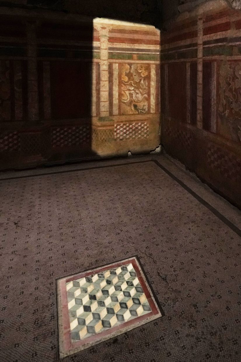 Details of the frescoes and mosaics that decorate the newly-restored underground House of Griffins, dated between the II and I century B.C., on the Palatine Hill next to the Colosseum, are seen during a guided tour for the press, in Rome.