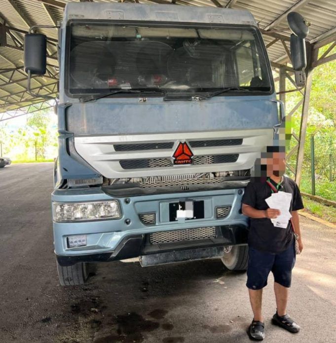 The driver who drove a lorry recklessly, endangering other vehicles at KM7.0 of Jalan Perani-Lok Heng, Kota Tinggi, surrendered himself and was issued a summons on Wednesday (Jan 14). — Kota Tinggi District Police Facebook