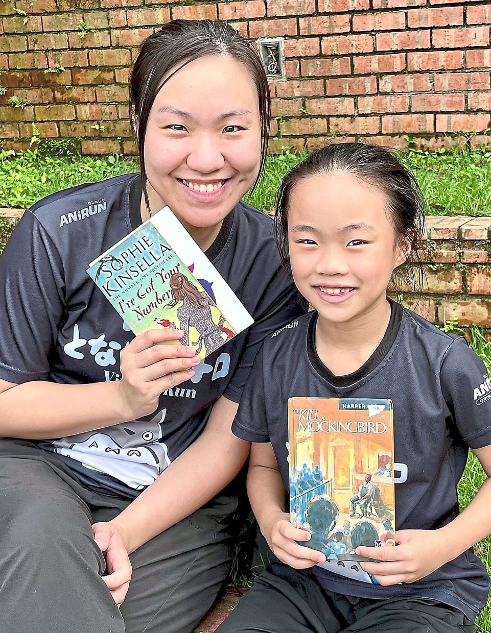 Ng and he daughter Sophia prefer reading preloved books as a way of combating the trend of overconsumption. 