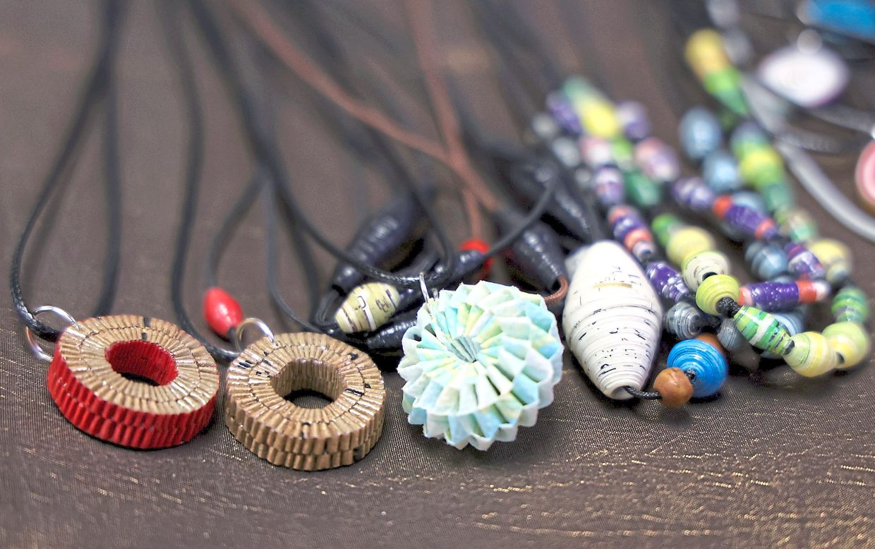 Handcrafted necklaces made from recycled paper prove that sustainable fashion can be stylish and affordable.