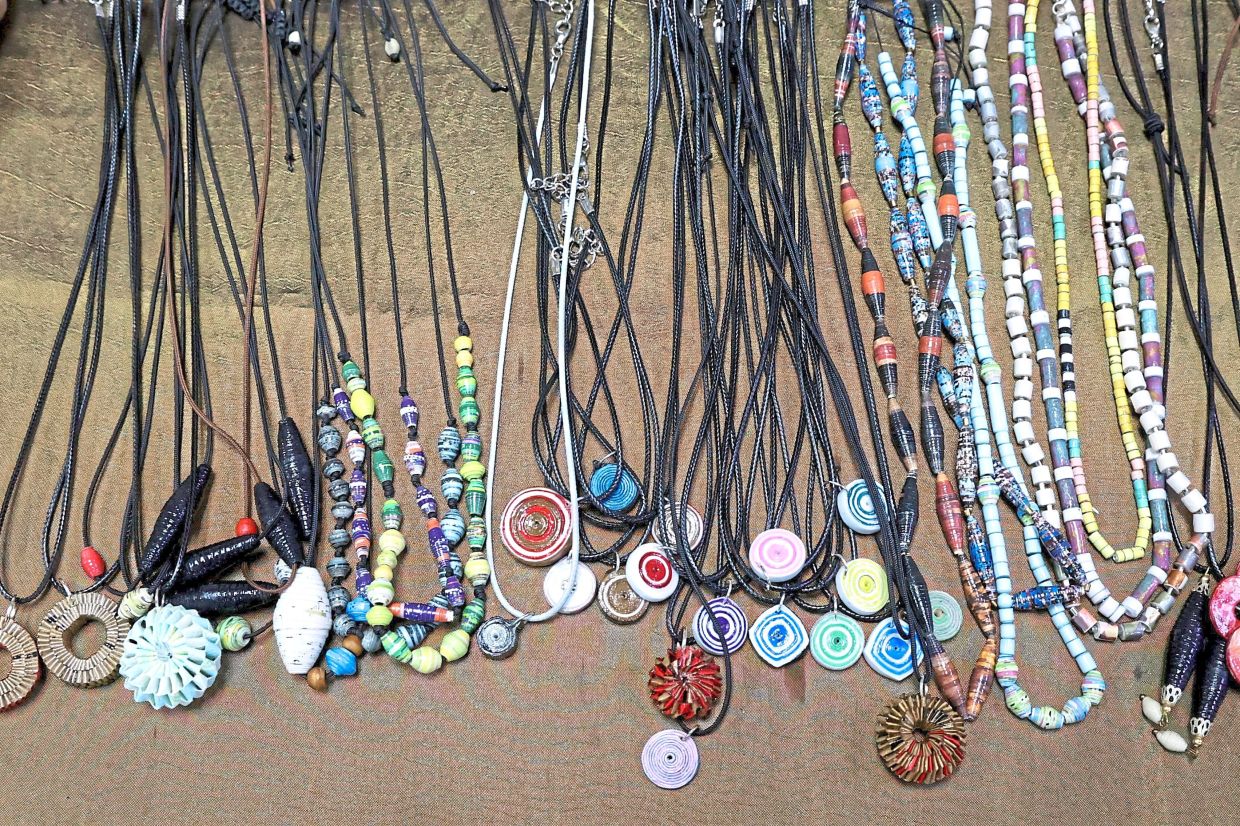 Handcrafted necklaces made from recycled paper prove that sustainable fashion can be stylish and affordable.