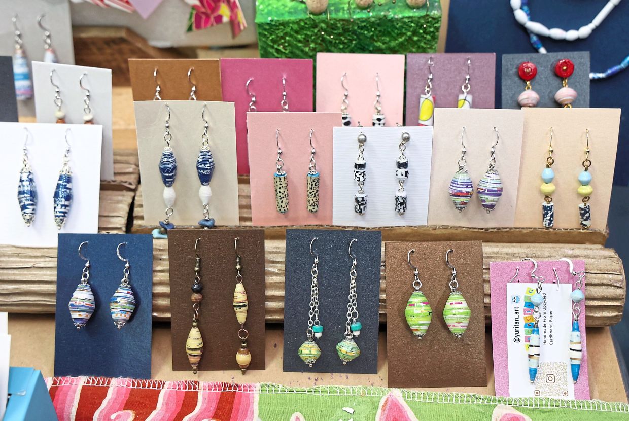 Colourful earrings made by Tan from paper beads.