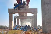 Crane crushes moving train