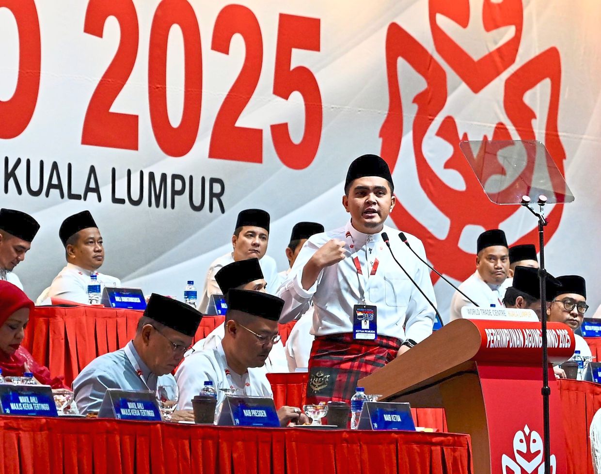 Sharing his news: Dr Muhammad Akmal speaking during the Umno General Assembly.