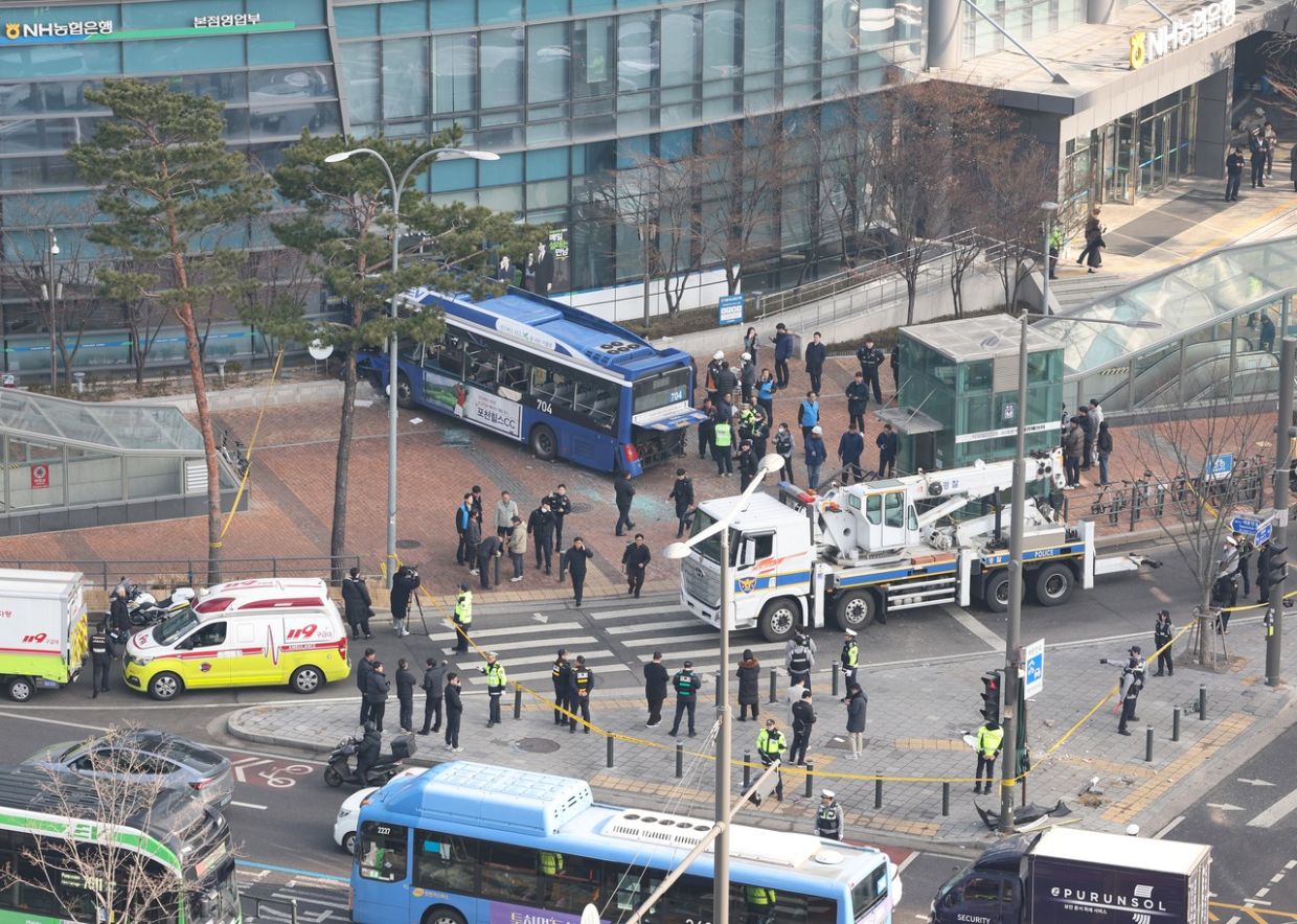 Bus runs over pedestrians as it crashes into Seoul building, 13 injured