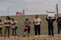US officials provide shifting accounts of ICE detainee death in Texas military camp