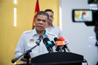 Former FMT reporter Rex Tan will be released after police record statement, says Home Minister