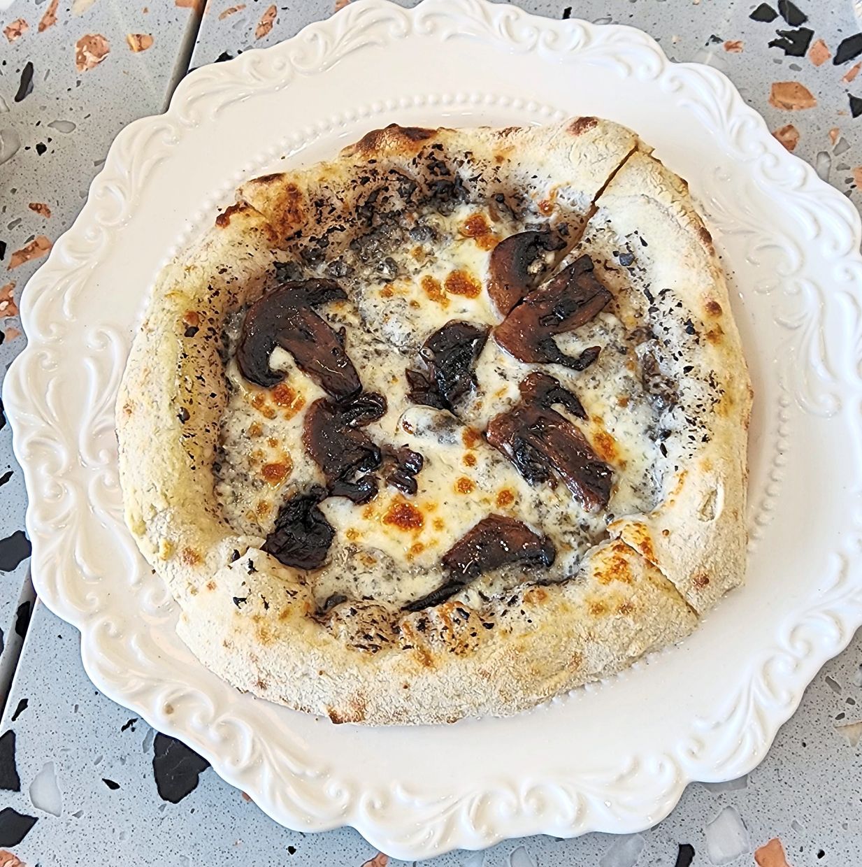 The mushroom and truffle pizza is decadent without being overbearing. — ABIRAMI DURAI/The Star