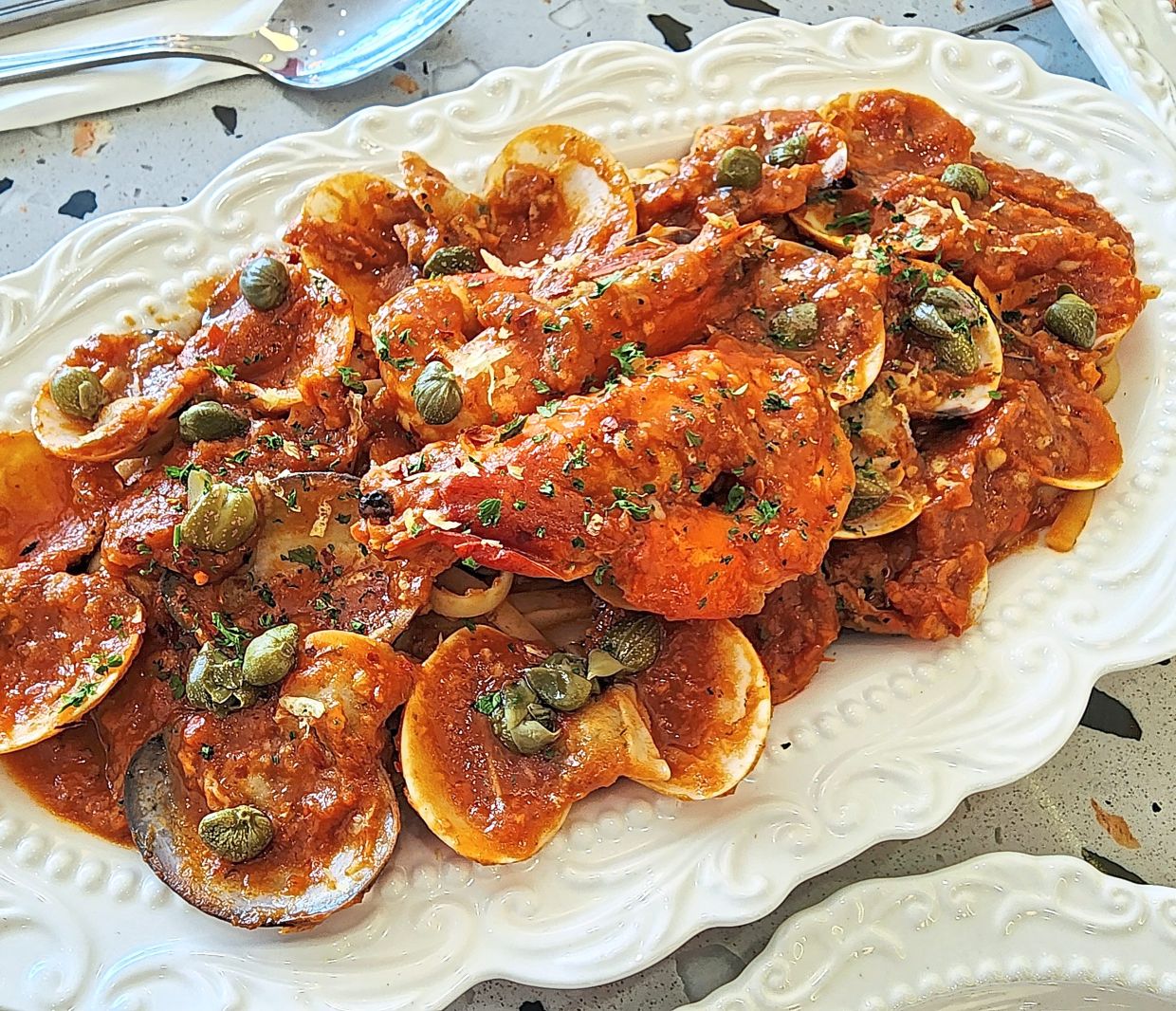 Prawns and clams form the centrepiece of this delicious arrabbiata dish which has a feisty, fiery tomato-laden heart and soul. — ABIRAMI DURAI/The Star