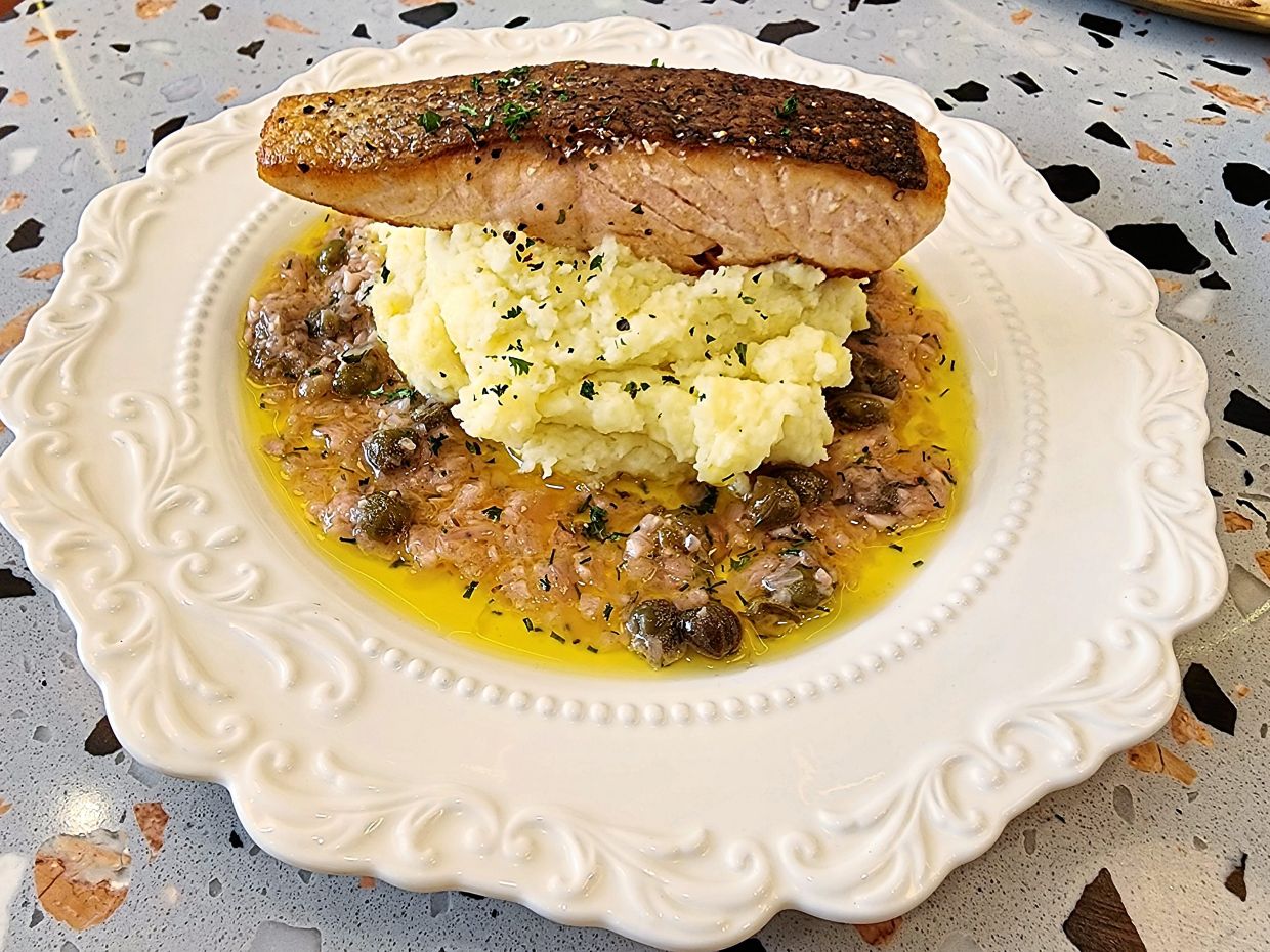 Once you’ve had the salmon with lemon butter caper sauce, it will be hard to imagine life without it. — ABIRAMI DURAI/The Star 