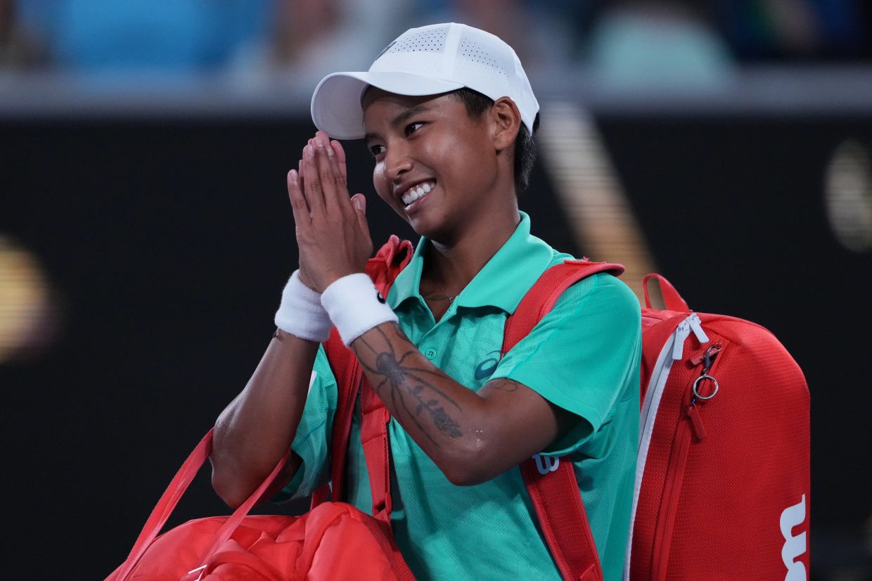 Mananchaya Sawangkaew of Thailand gestures after first round loss to Emma Raducanu of Britain at the Australian Open tennis championship in Melbourne, Australia, on Sunday, Jan 18, 2026. -- AP Photo/Asanka Brendon Ratnayake
