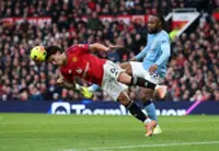 Soccer-Arsenal held but go seven points clear, Carrick inspires dominant derby win for Man United