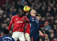 Soccer-Arsenal frustrated by feisty Forest but move seven points clear at top