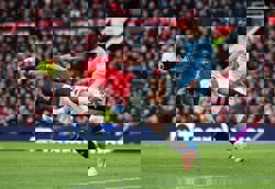 Soccer-Carrick inspires dominant derby win for Man United, Liverpool draw again