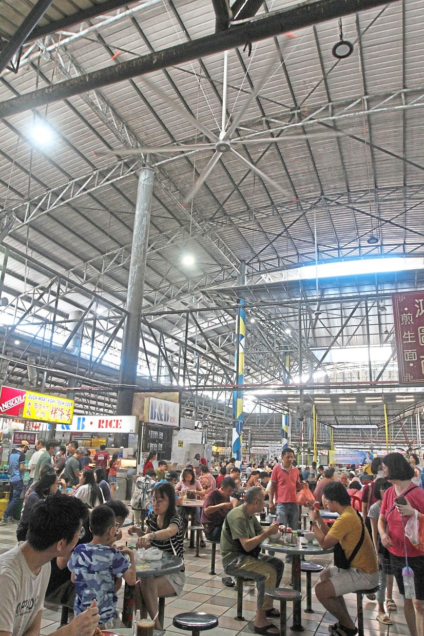 The hawker complex in Bayan Baru Market with giant ceiling fans. 
