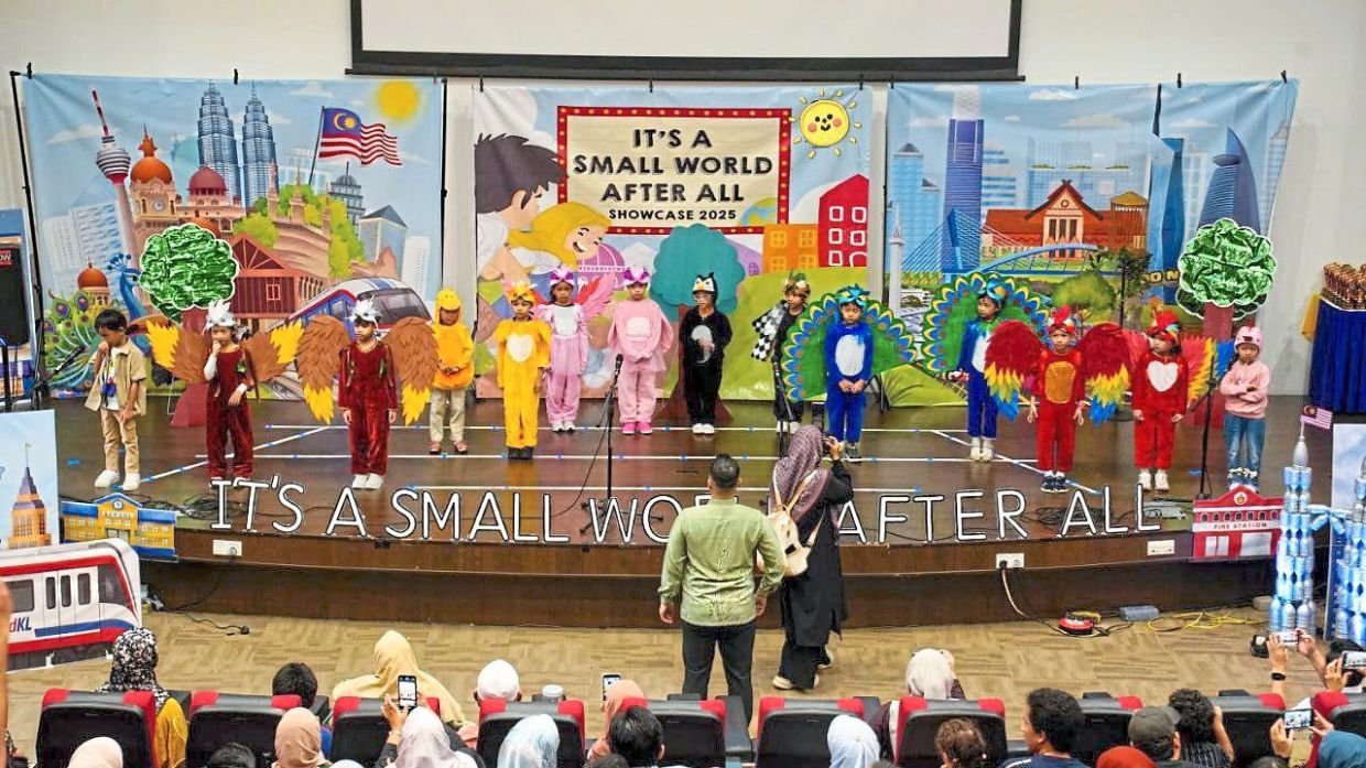Kindergarten teachers and parents must work closely together in educating children as it is a two-way process, the writer (in green batik facing the stage) says and adds that a child’s learning journey never stops, whether at school or at home.