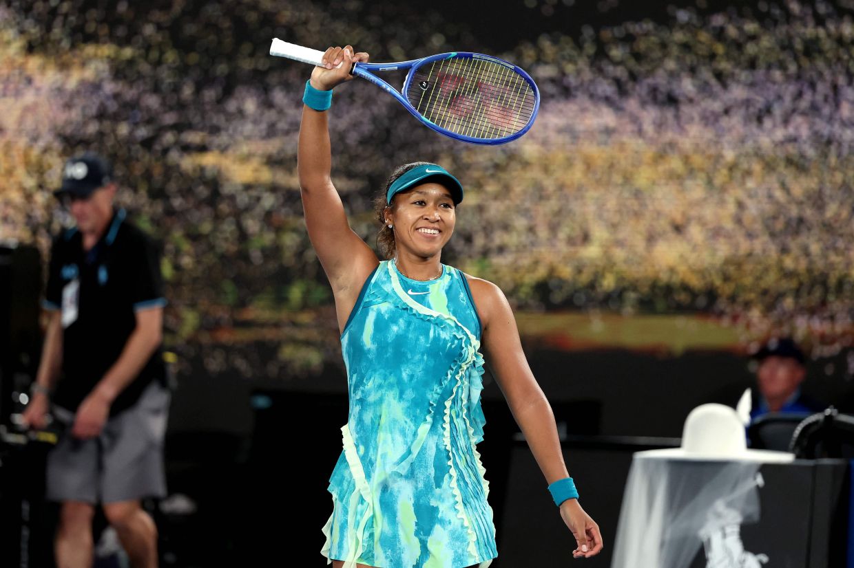 Japan's Naomi Osaka celebrates victory over Croatia's Antonia Ruzic after their women's singles match on day three of the Australian Open tennis tournament in Melbourne on Tuesday, January 20, 2026. -- Photo by Martin KEEP / AFP