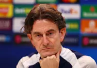 Soccer-Problems mount for Tottenham's Frank, but vows to fight on