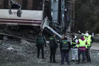 Spain deploys heavy machinery to find missing bodies among train crash wreckage