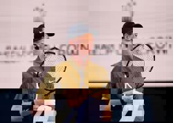 Tennis-Sinner through to Australian Open second round after Gaston retires