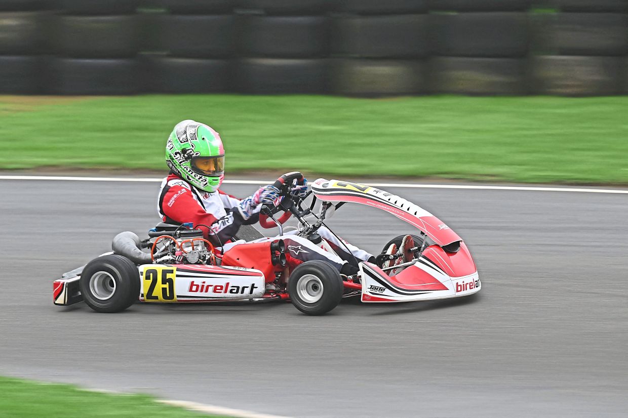 Parker whizzing around the karting track. Photo: AFP