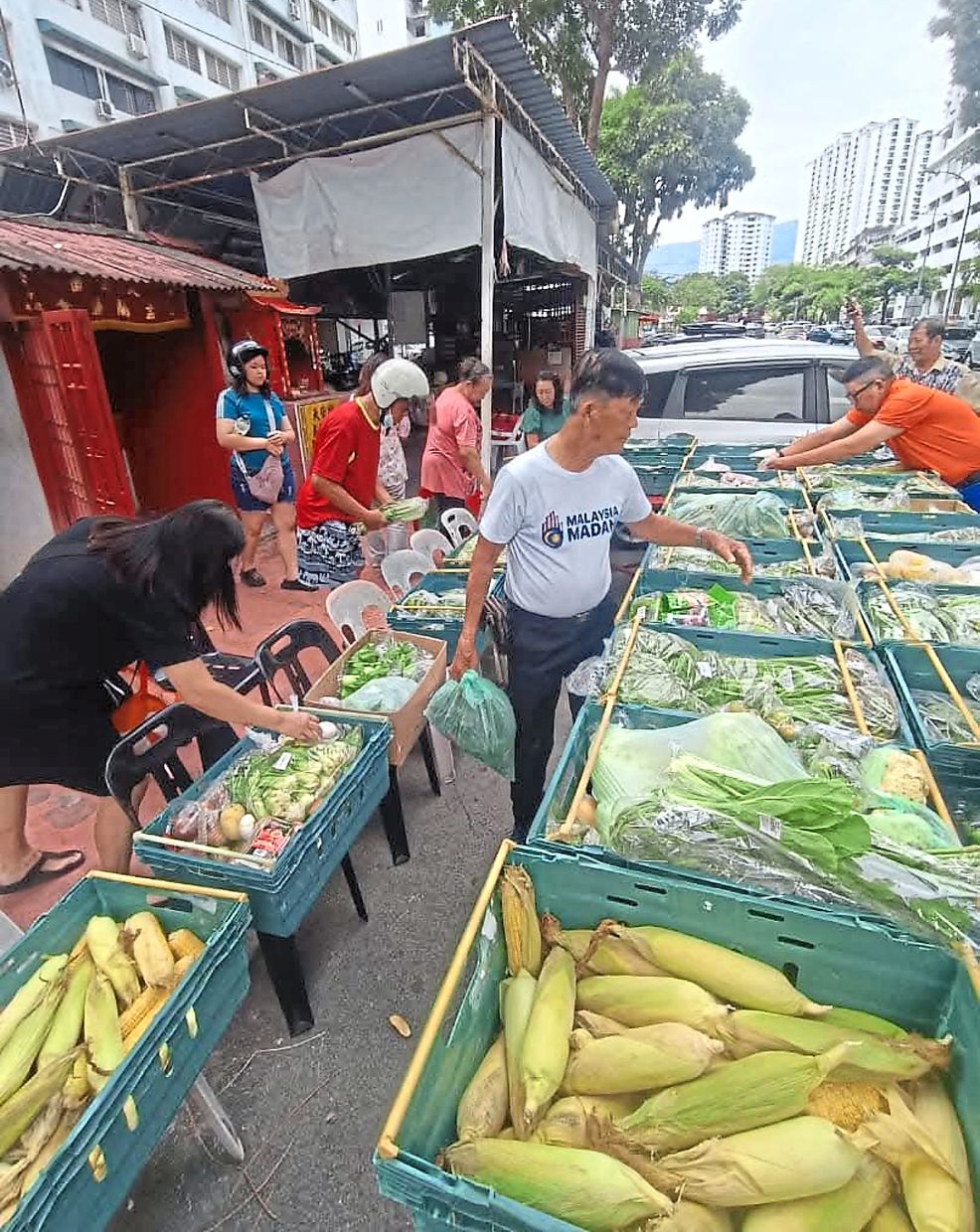 Penang folk receiving perishables from the Mutiara Food Bank via the Taman West MPKK in Jelutong, Penang. — Courtesy photo