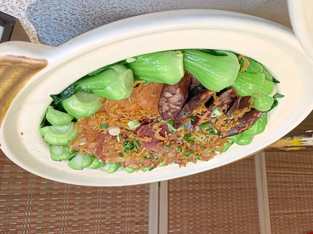 Cantonese-Style Cured Duck Breast, Chicken Sausage, Goose Liver Sausage and Sakura Shrimp with Fragrant Rice. 