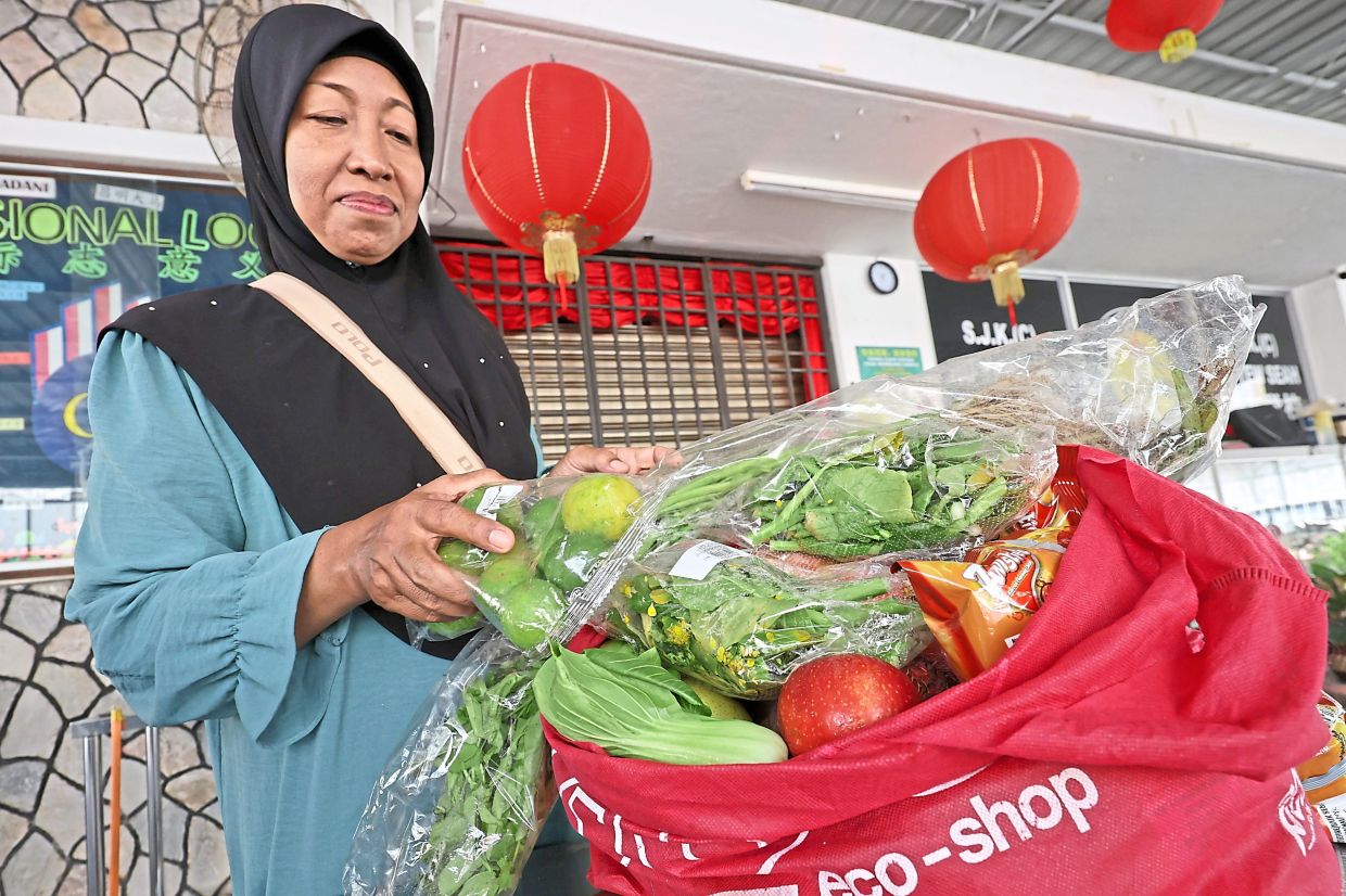 Zuriah with the vegetables and fruits that she picked during the food bank distribution. 