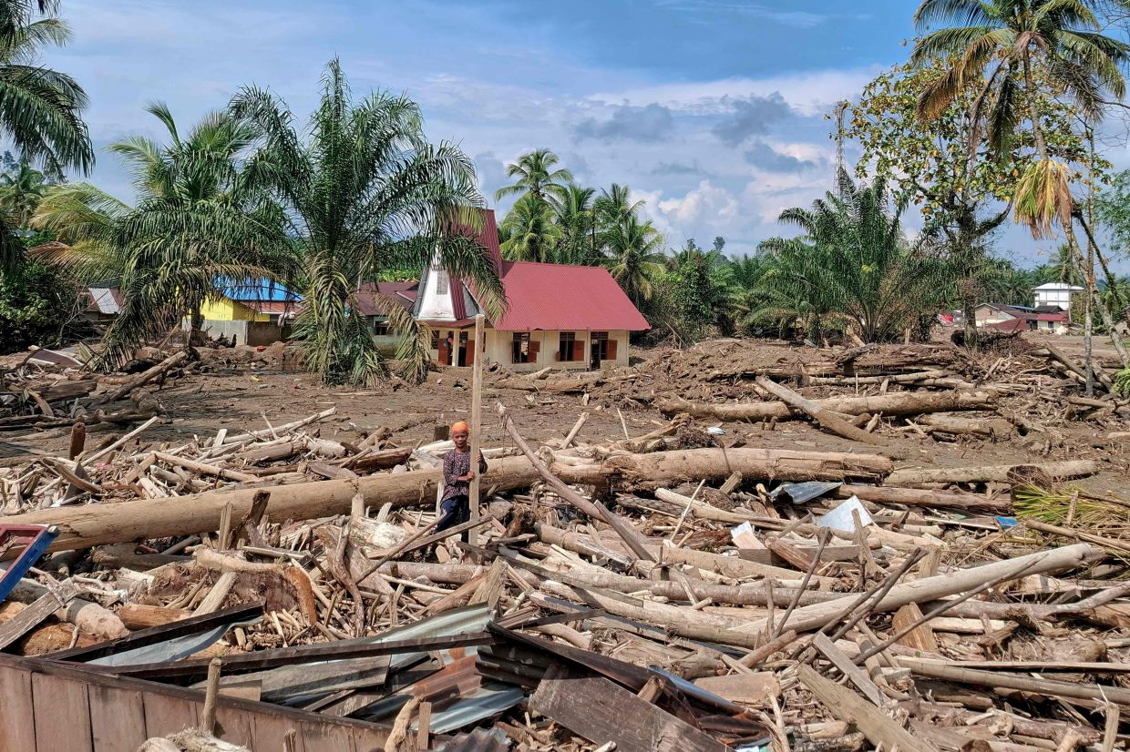 Indonesia revokes permits of 28 firms after deadly floods
