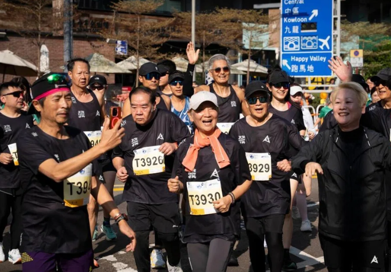 Chow Yun Fat (back row, middle) with Kent Cheng (T3926), Nina Paw (T3930) and Lau Kong (T3929) at the Standard Chartered Hong Kong Marathon on Jan 18. Photo: Standard Chartered Hong Kong Marathon/Facebook