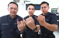 Policemen cast their votes