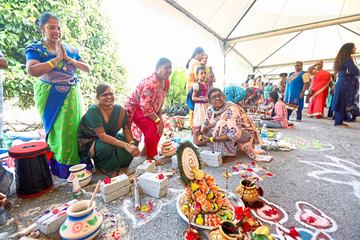 Jayanthi (second from left) taking part with a neighbour and friends.