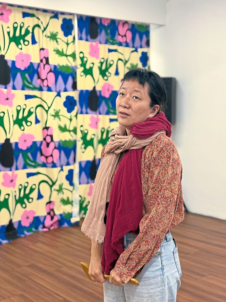 Yon Lynn appears in the theatre work 'Kenapa Tak Tukar Nama?', one of the three solo performances in 'BUKA'. Photo: Five Arts Centre