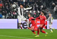 Soccer-Juventus clinch playoff place with 2-0 win over Benfica