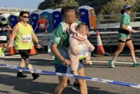 Hong Kong marathon runner with baby investigated for child abuse