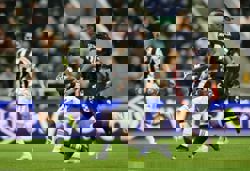 Soccer-Newcastle ease to 3-0 win over PSV to book knockout place