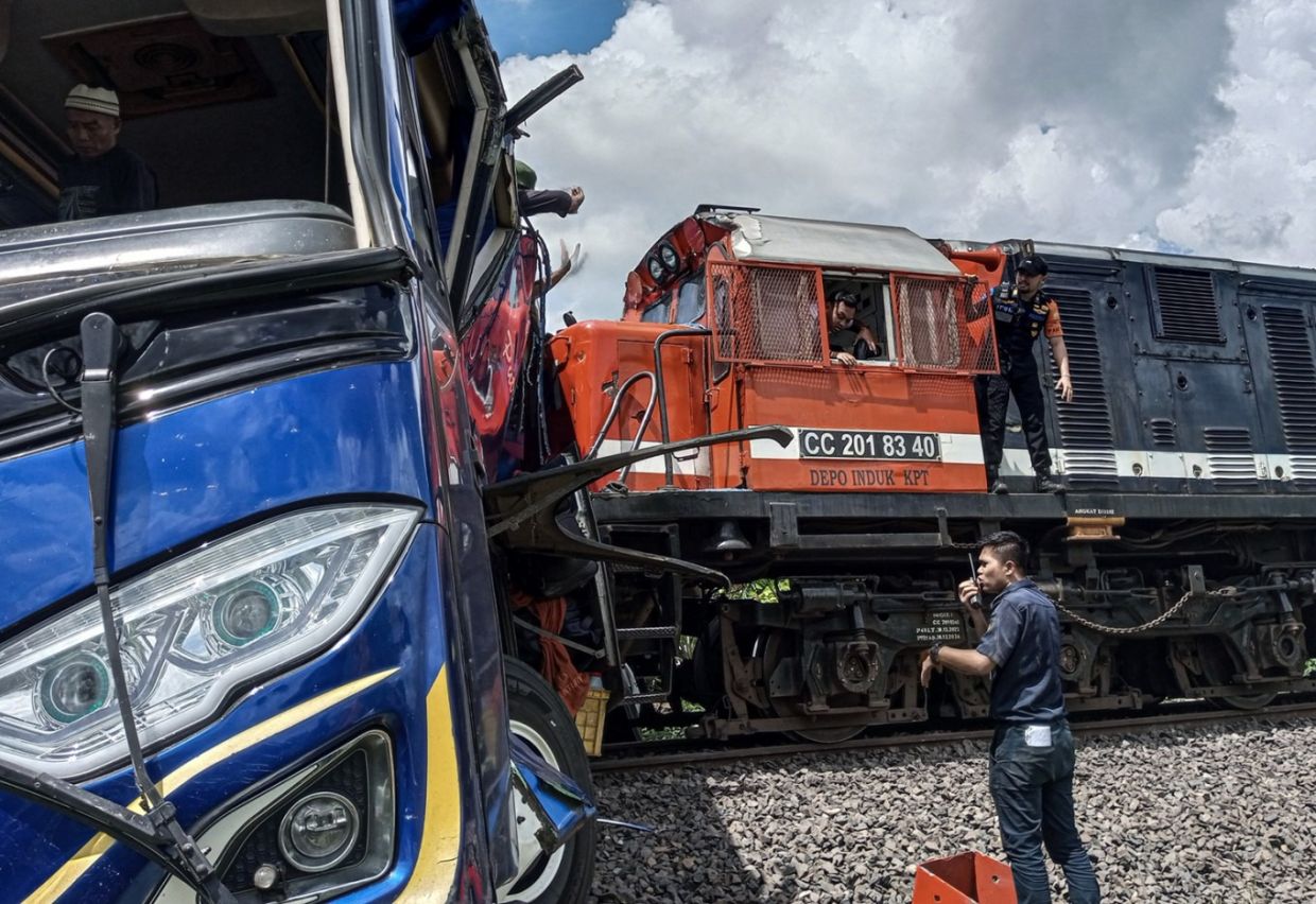 Nine killed after train collides with car in North Sumatra