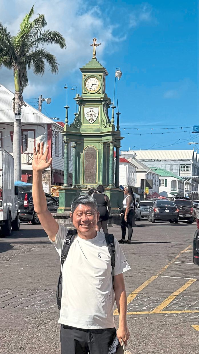 The writer at Basseterre in St Kitts and Nevis, standing in front of the Berkeley fountain and memorial clock. The island nation gained independence in 1983 and is a member of the Commonwealth. — Photos: LEESAN