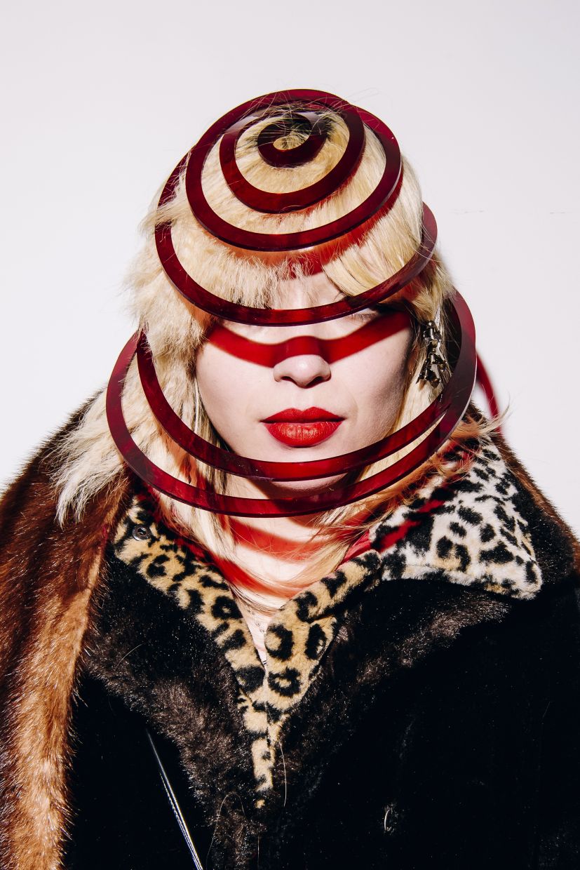 Riley Verri with a handmade plastic chapeau resembling a series of Saturn’s rings that she purchased at Cyndi Lauper’s “closet cleanout” in New York. Photo:The New York Times