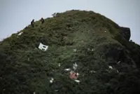 Indonesia finds bodies of 10 passengers on crashed surveillance plane