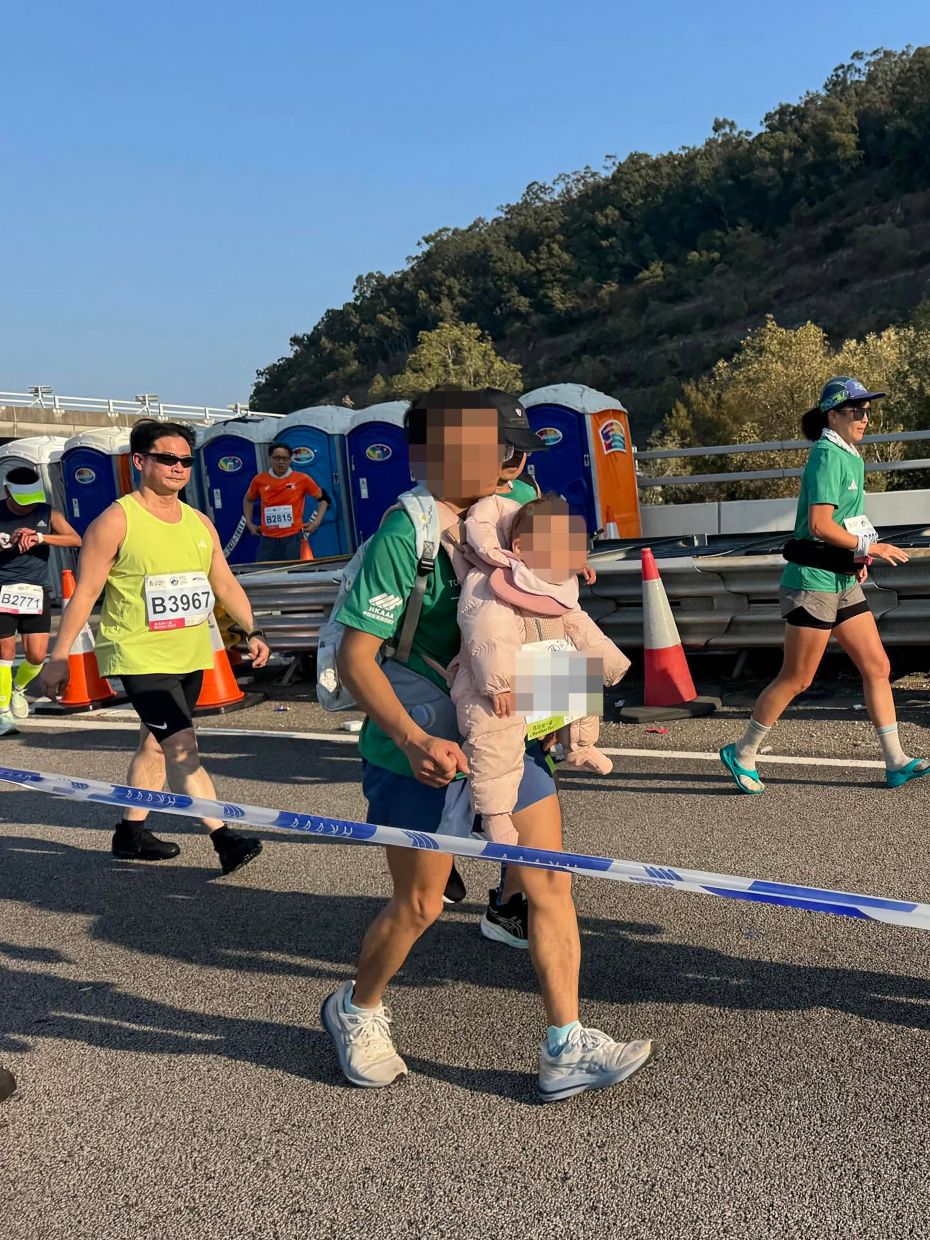 Police probe child abuse report after man runs with baby in Hong Kong Marathon