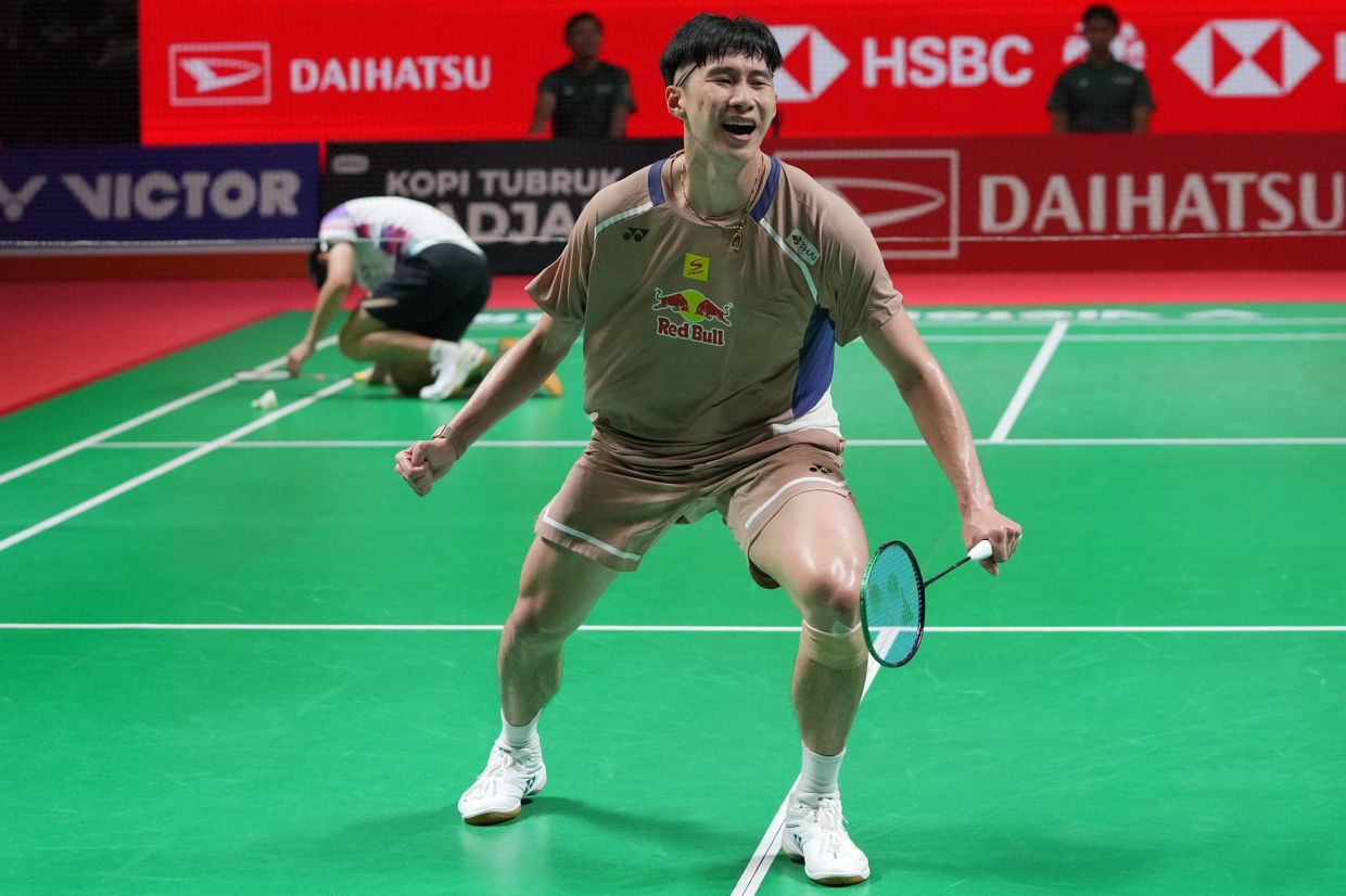 Thailand's Panitchaphon Teeraratsakul celebrates after defeating Singapore's Kean Yew Loh during their men's singles semifinal at the Indonesia Masters badminton tournament in Jakarta, Indonesia, on Saturday, Jan. 24, 2026. -- AP Photo/Achmad Ibrahim