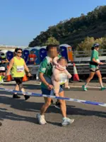Police probe child abuse report after man runs with baby in Hong Kong Marathon