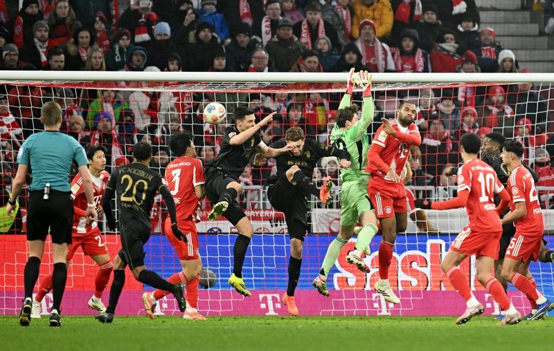 Soccer-Augsburg stage 2-1 comeback win to snap hosts Bayern's unbeaten Bundesliga run