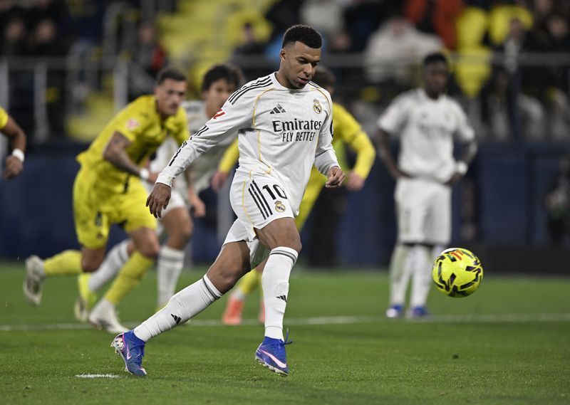 Soccer-Mbappe double powers Real Madrid past Villarreal to top of LaLiga
