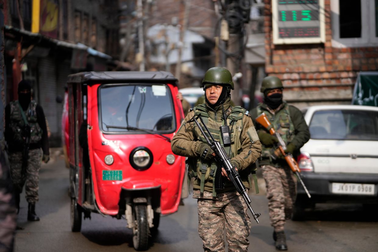 Indian paramilitary soldiers guard during a house-to-house search operation as part of heightened security measures ahead of India's Republic Day in Srinagar, Indian controlled Kashmir, on Sunday, Jan. 25, 2026. -- AP Photo/Mukhtar Khan